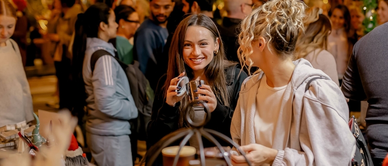 two women shop and enjoy The Holiday Promenade